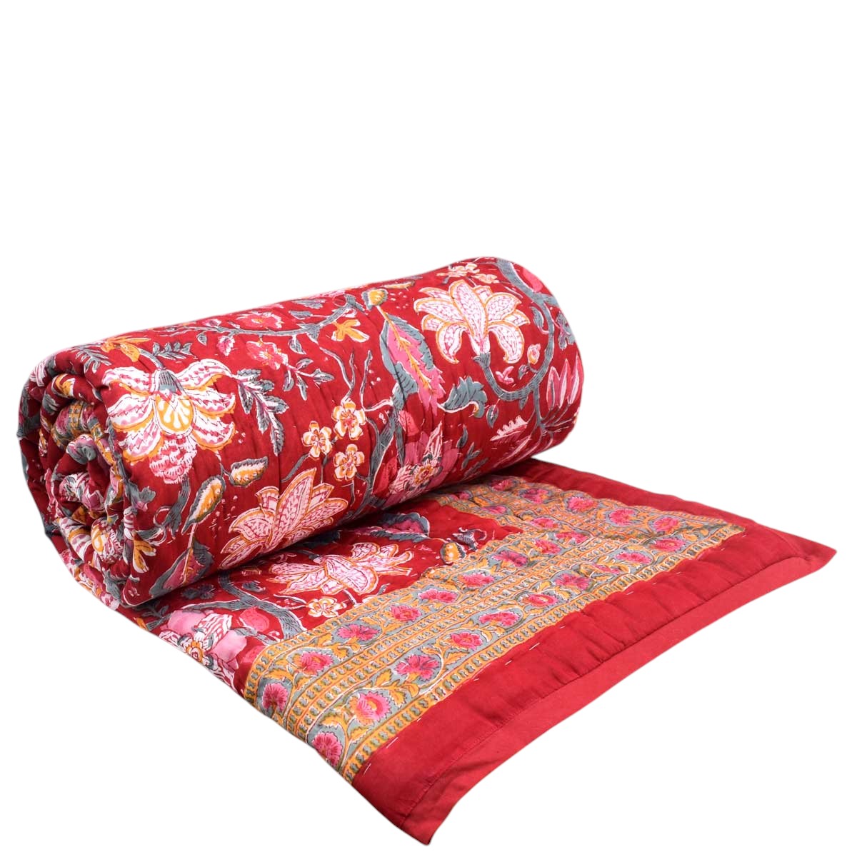 A rolled red quilted blanket with intricate floral embroidery and a decorative border, shown partially unrolled on a plain white background.