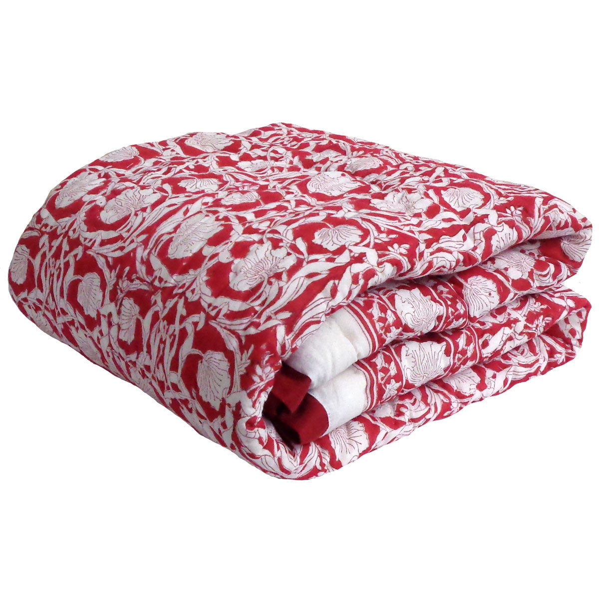 A folded quilted blanket featuring a red and white floral toile pattern, shown against a plain white background.