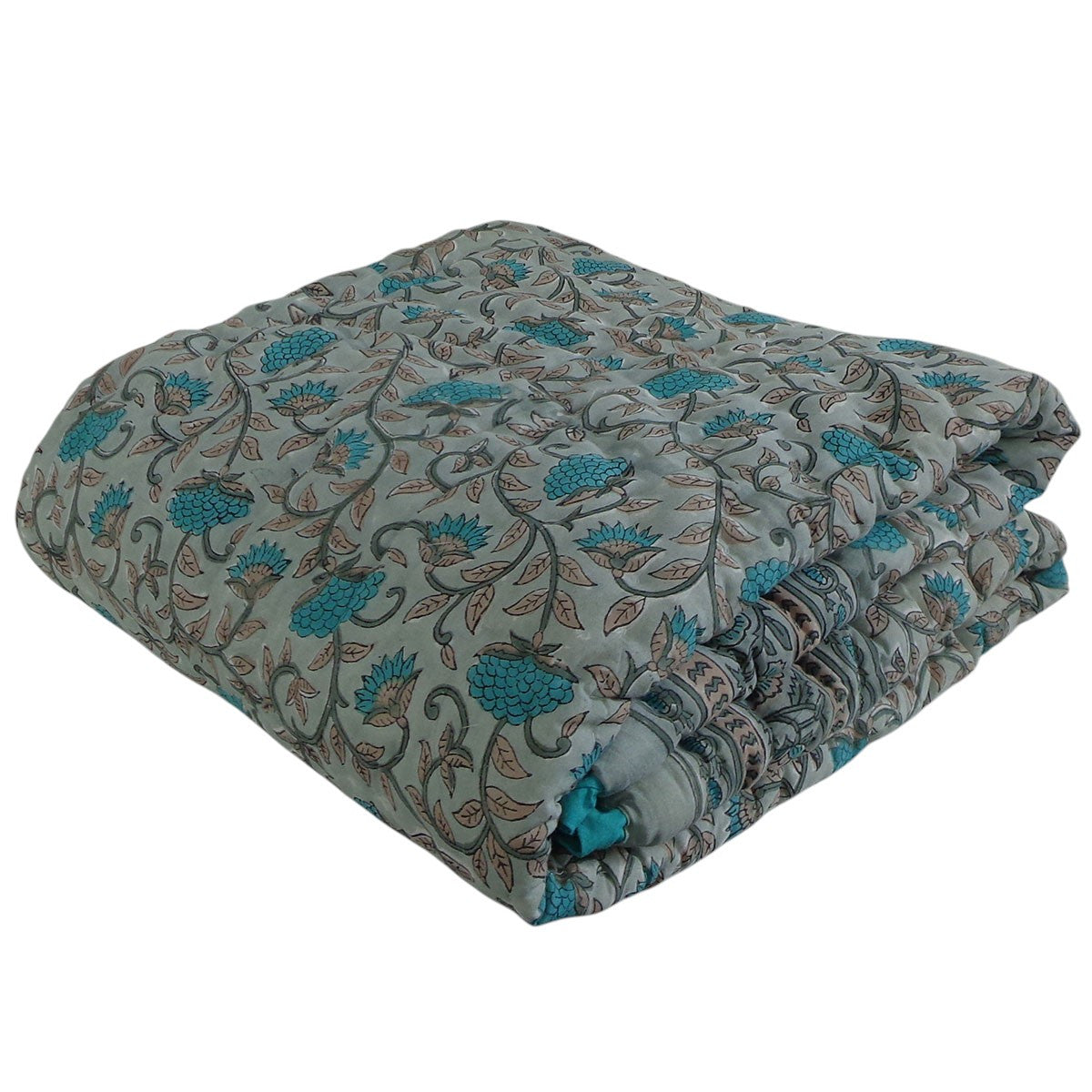 A folded quilted comforter with a floral vine pattern in teal blue, brown, and gray on a light gray background, isolated on a white background.