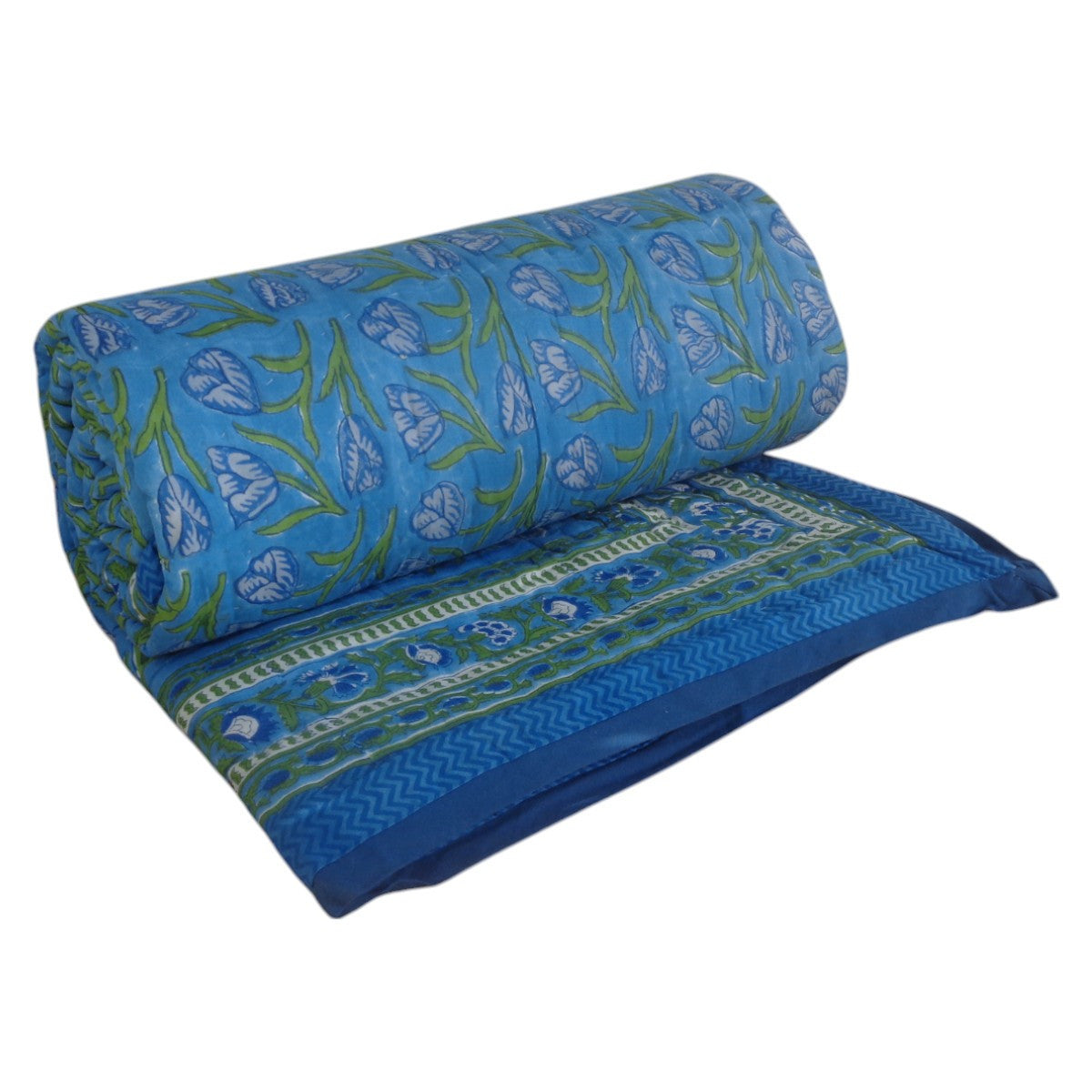 A folded and rolled blue quilted blanket with a green and white floral block print pattern, shown on a plain white background.