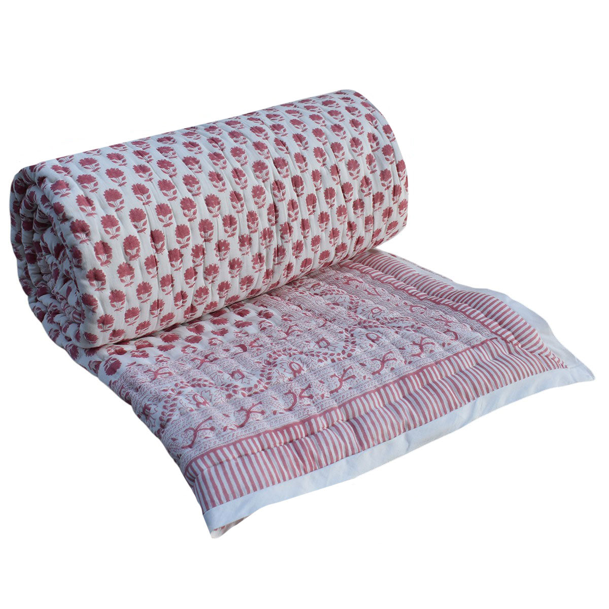 A rolled-out quilted blanket with a pink and white floral block print pattern and a striped border, shown on a plain white background.
