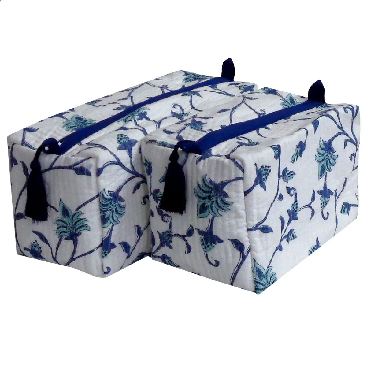 Two quilted storage bags with a blue and green floral vine pattern on a white background, featuring dark blue zipper pulls and black tassels, shown on a plain white background.