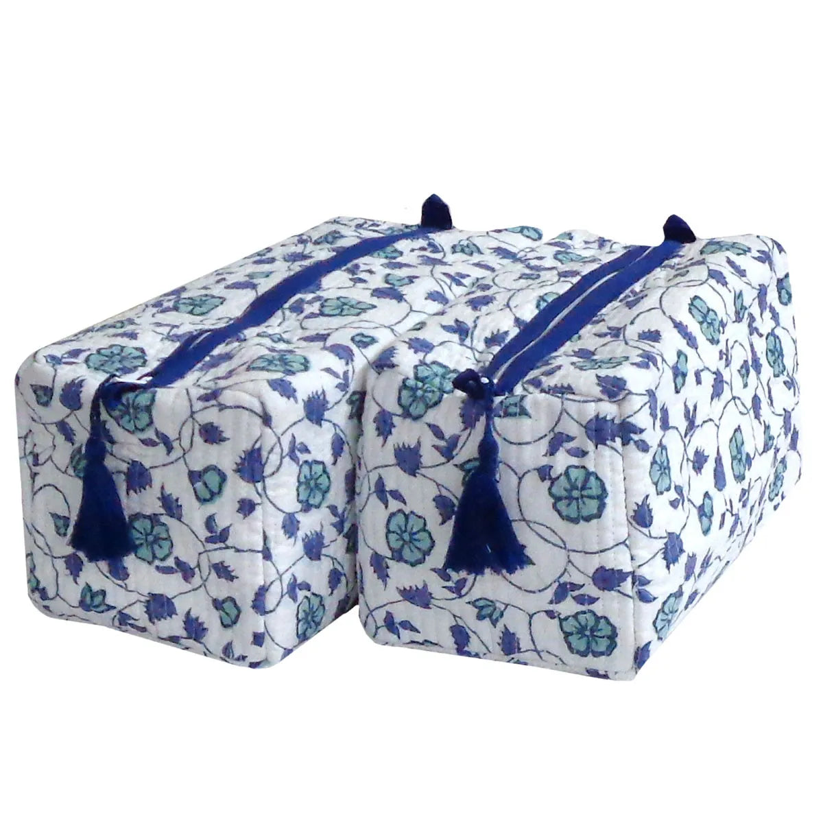 Two square quilted storage boxes with a blue and green floral pattern on a white background, featuring blue tassels and drawstring ties.