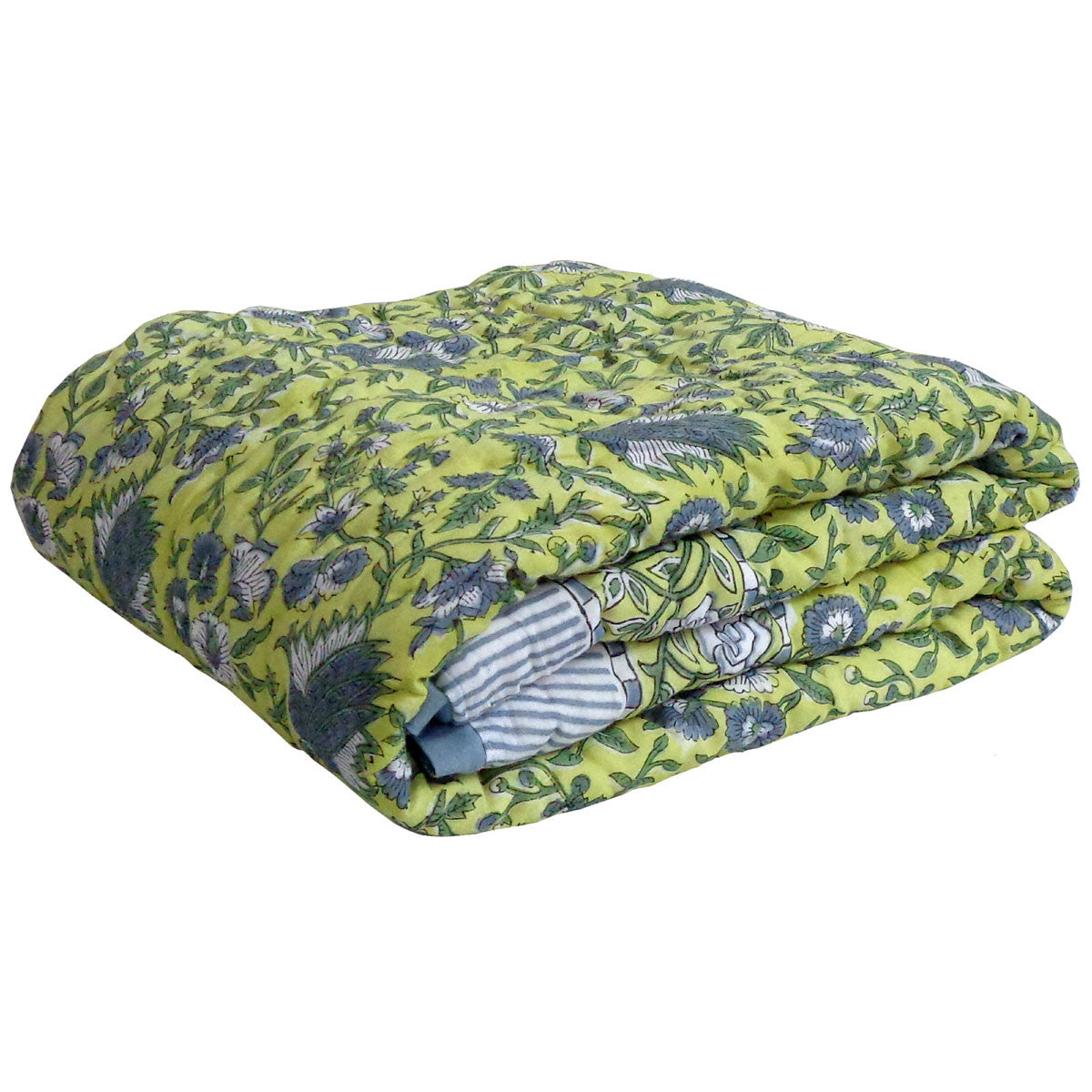 A folded quilted comforter with a vibrant lime green background and a detailed blue and gray floral/bird pattern, featuring a striped fabric lining visible at the fold.