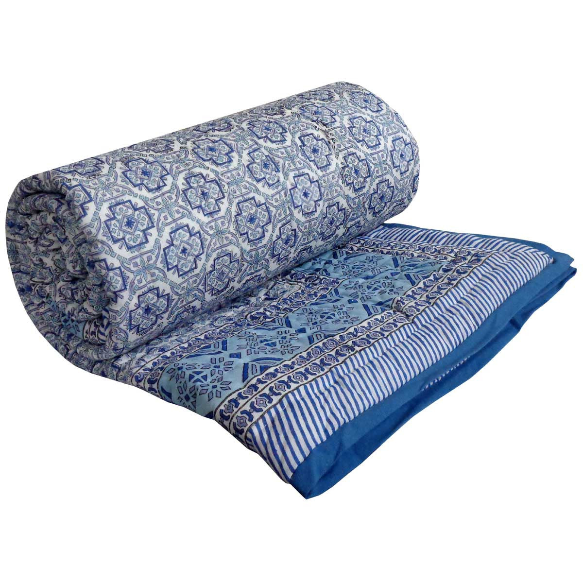 A rolled and partially unrolled blue patterned textile, likely a blanket, throw, or fabric panel, shown on a plain white background.