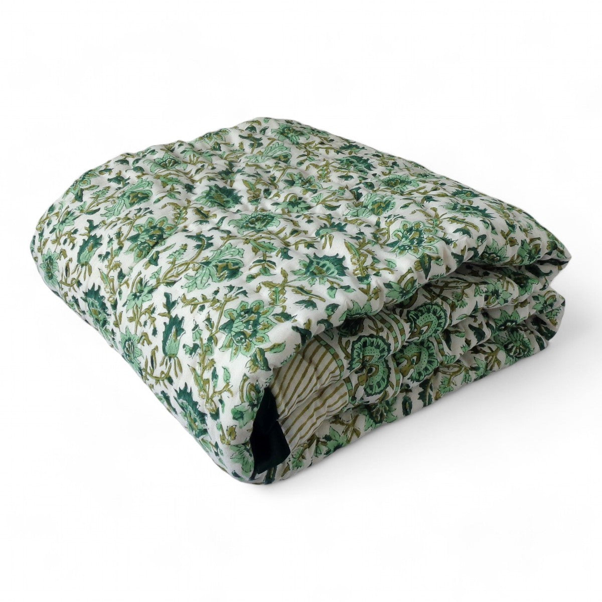 A folded quilted comforter or duvet with an intricate green and beige floral pattern on a white background, shown on a clean white studio background.