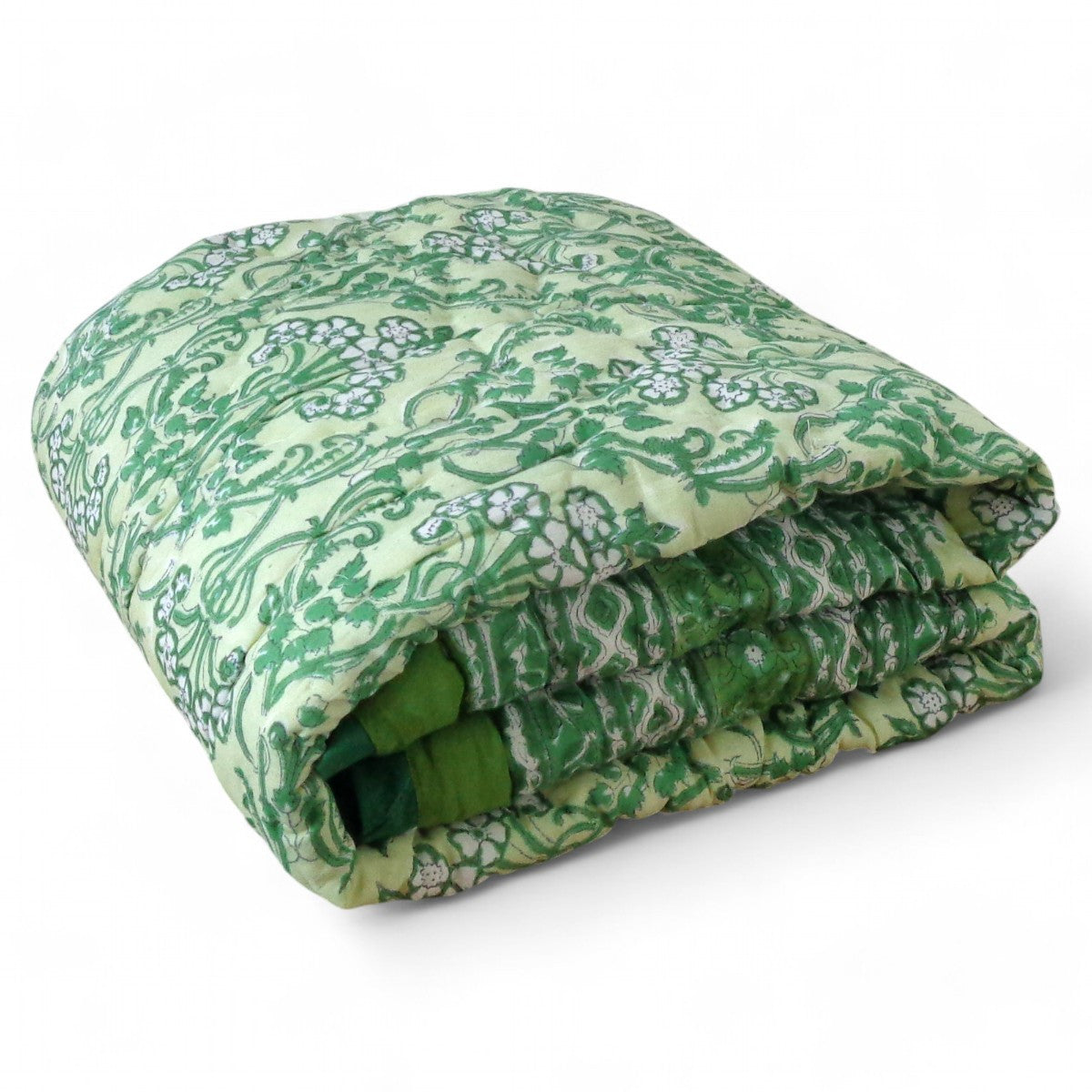 A folded quilted blanket featuring a green and white floral damask pattern, displayed on a clean white background.