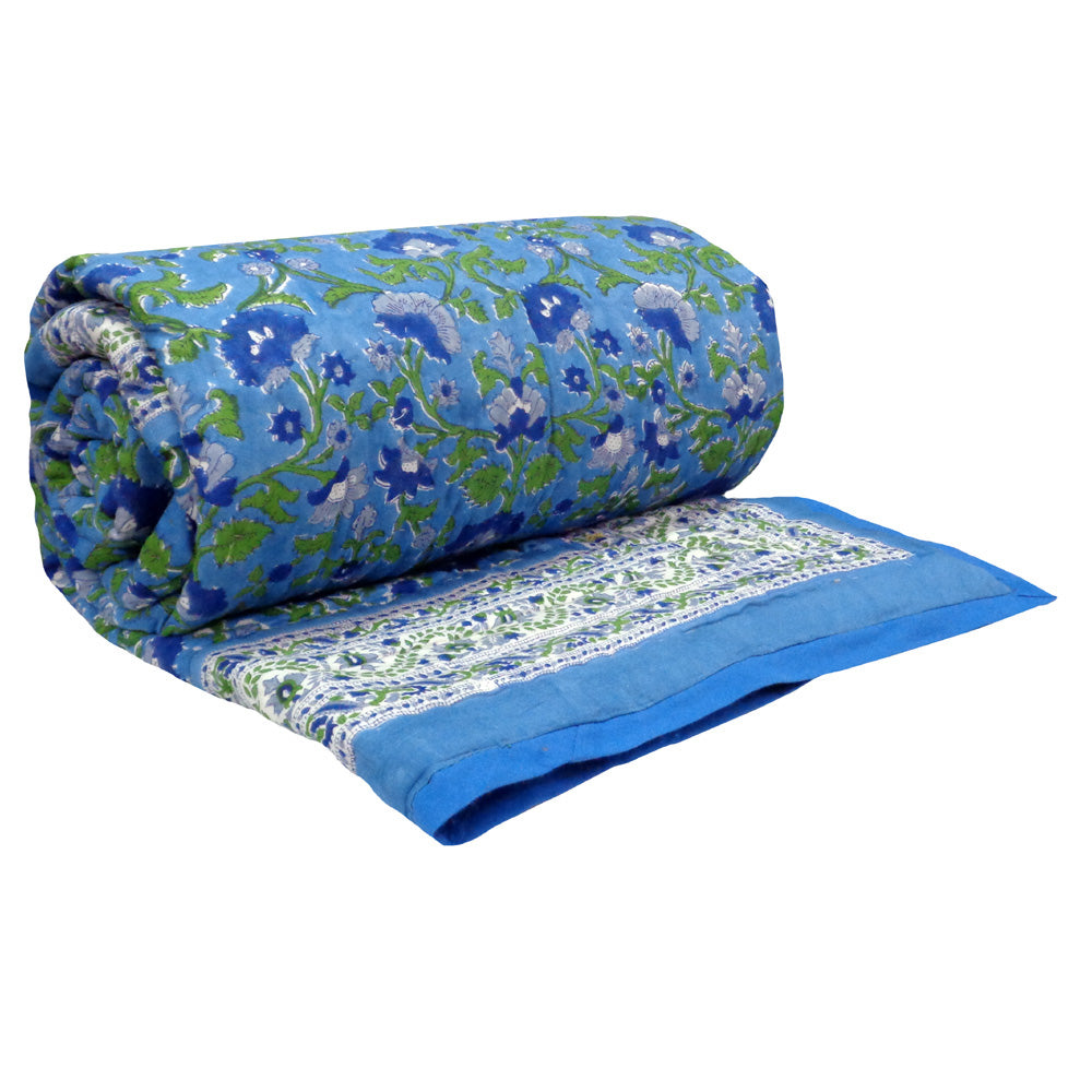 Rolled-up floral-patterned fabric on a white background