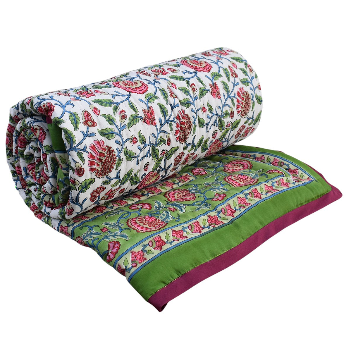 A folded and rolled quilted blanket featuring a white base with a vibrant red and green floral block print, finished with a solid green border and a magenta underside.