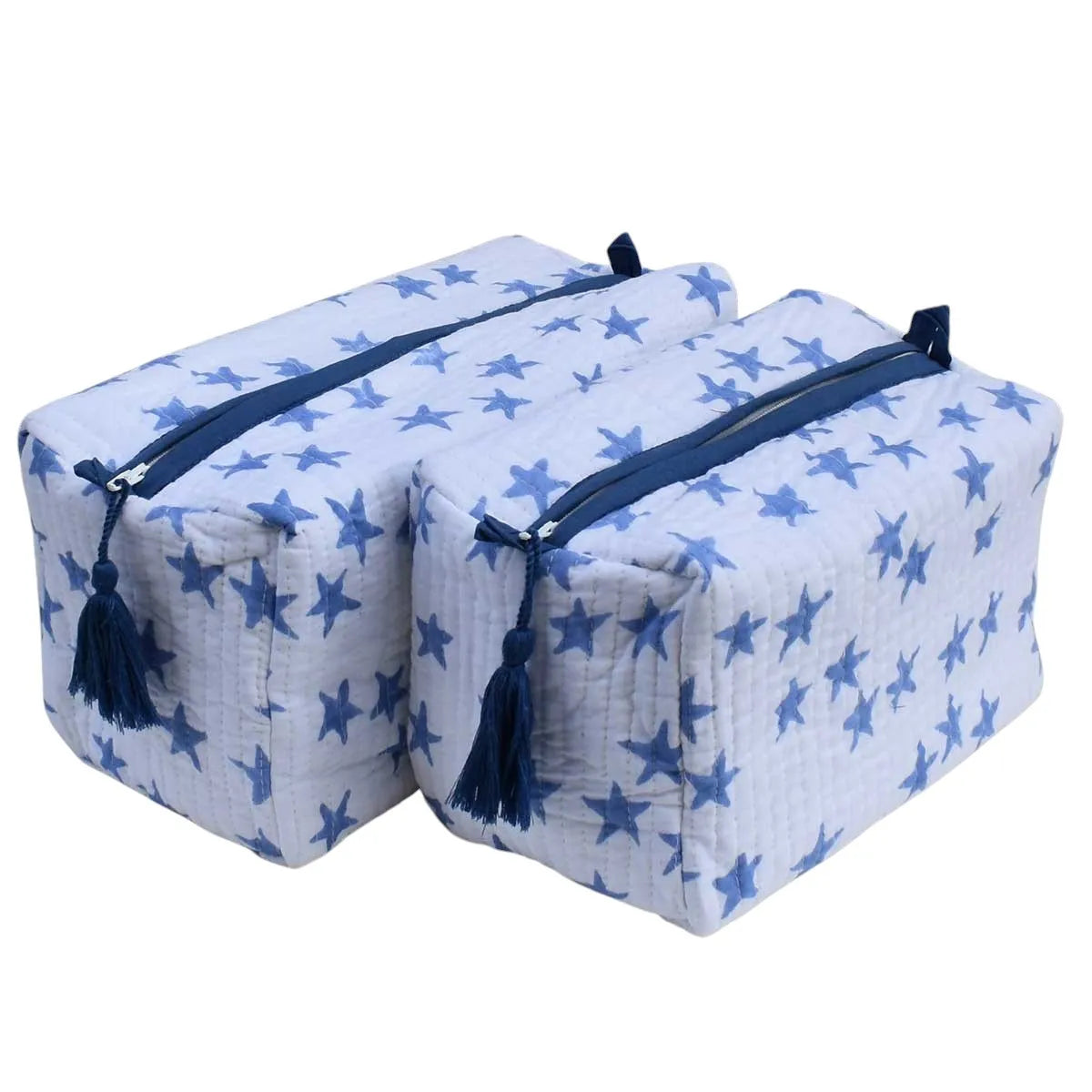 Two quilted cotton muslin storage bags with a blue star pattern, navy blue zippers, and matching tassel pulls, shown on a plain white background.